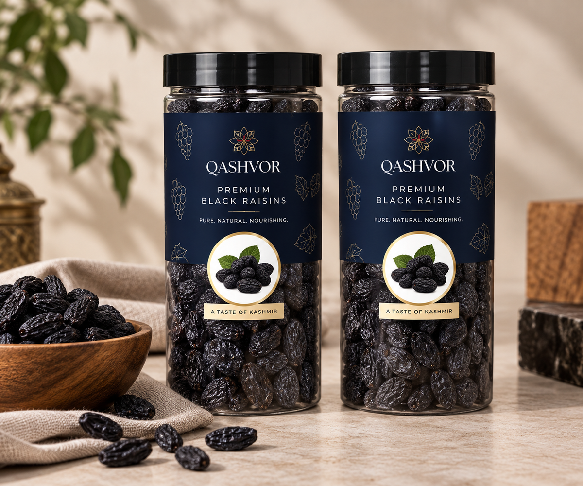Two jars of Qashvor black raisins with a bowl of black raisins