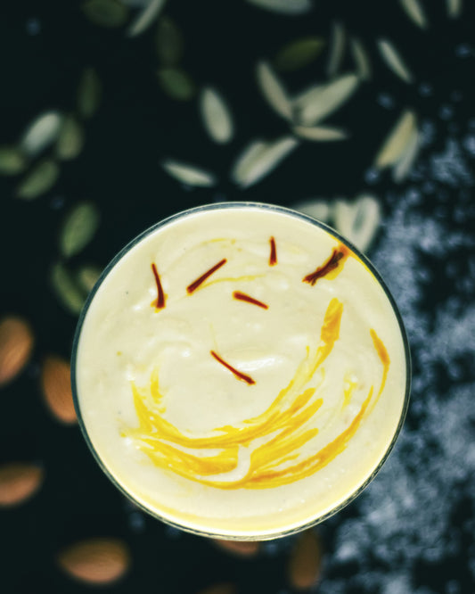 A bowl of creamy pudding topped with saffron threads