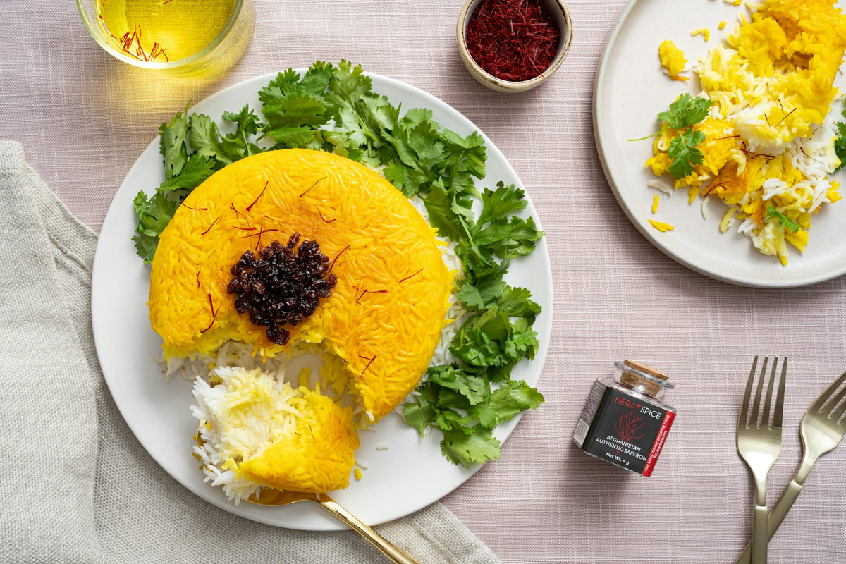Golden saffron rice served on a plate with fresh herbs