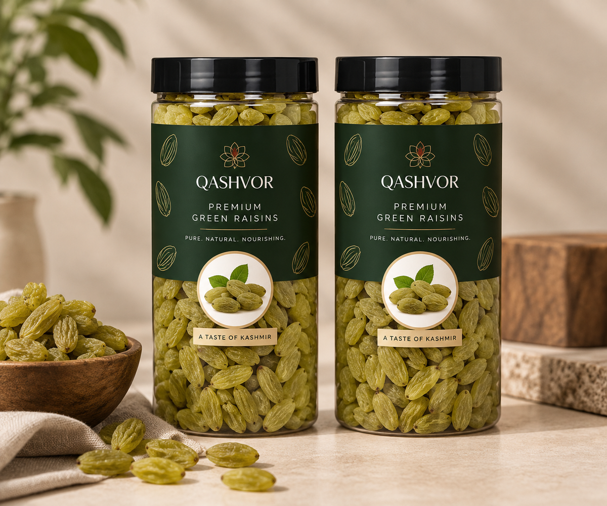 Two jars of Qashvor green raisins with a bowl of green raisins