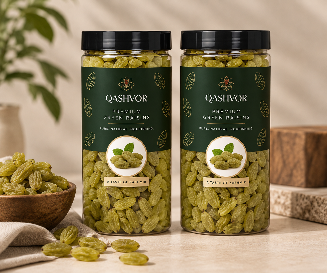 Two jars of Qashvor green raisins with a bowl of green raisins